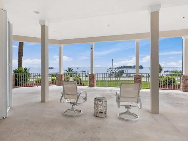 view of patio with a water view