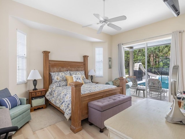 bedroom featuring ceiling fan, light hardwood / wood-style floors, and access to outside