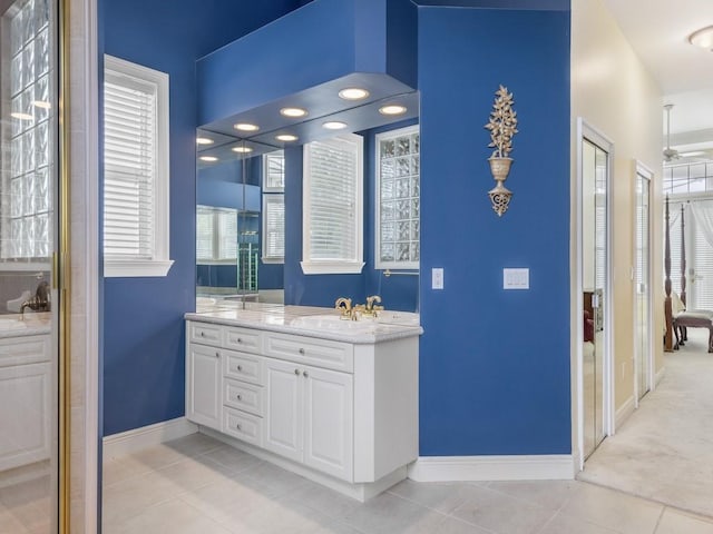 bathroom featuring tile patterned flooring and vanity