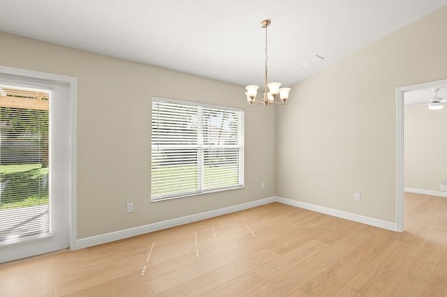 1590 Polynesian Ln, Sebastian, FL 32958 - unfurnished room with light wood-type flooring and a chandelier