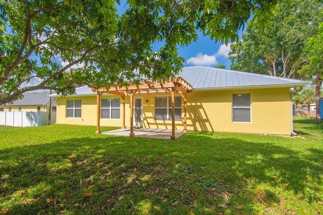 1590 Polynesian Ln, Sebastian, FL 32958 - back of house with a pergola, stucco siding, a patio area, and a metal roof