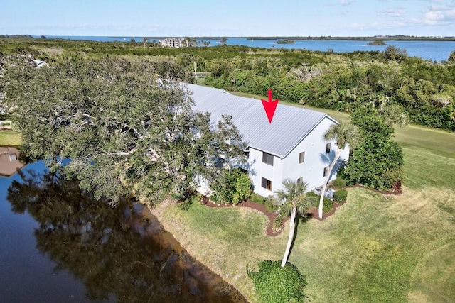 birds eye view of property featuring a water view