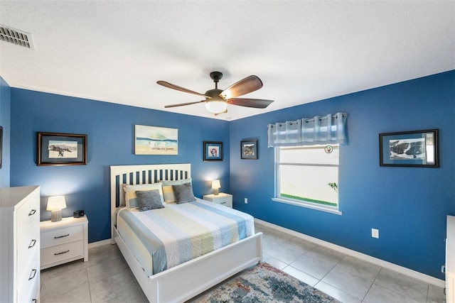 tiled bedroom with ceiling fan