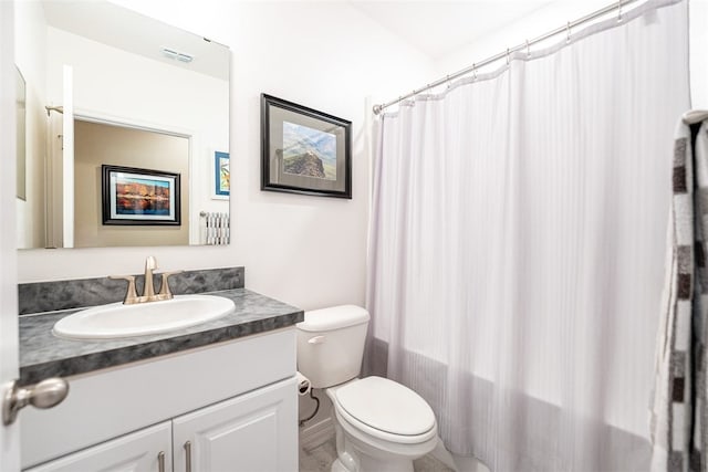 full bathroom with vanity, shower / bath combo, and toilet