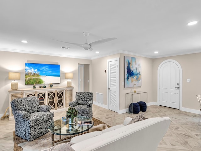 living room featuring ceiling fan, crown molding, and light parquet floors