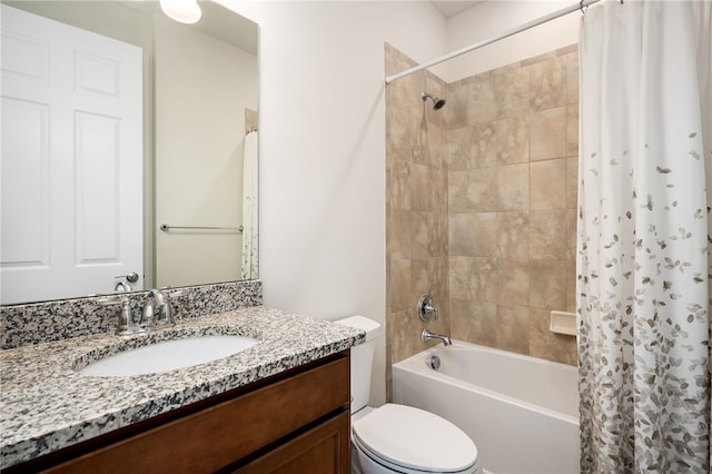 full bathroom with shower / tub combo with curtain, vanity, and toilet