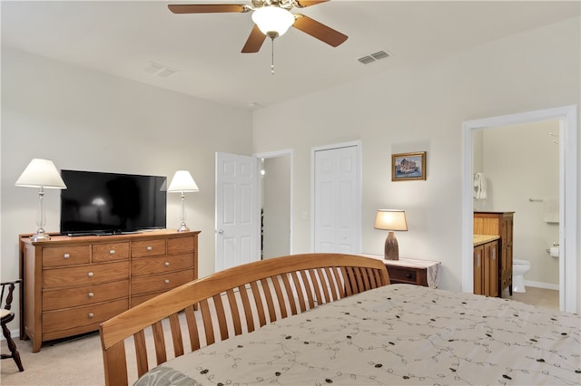 carpeted bedroom with ceiling fan, connected bathroom, and a closet