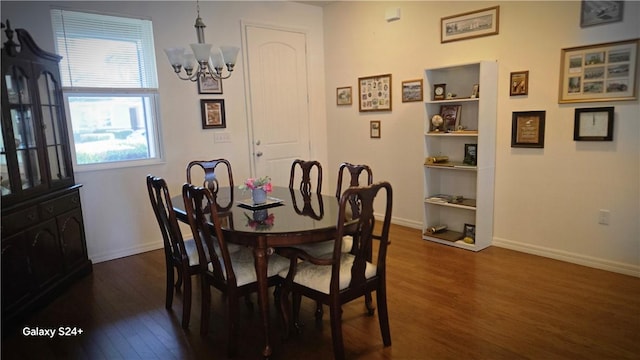 dining room with an inviting chandelier and dark hardwood / wood-style flooring