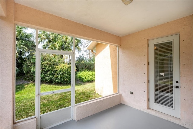 unfurnished sunroom with plenty of natural light