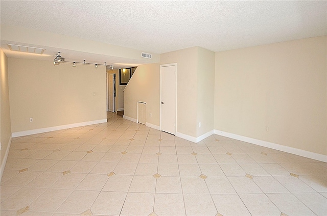 empty room with a textured ceiling