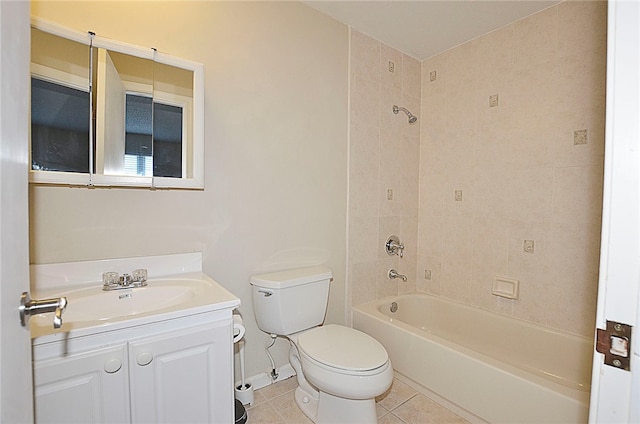 full bathroom featuring vanity, tile patterned floors, toilet, and tiled shower / bath