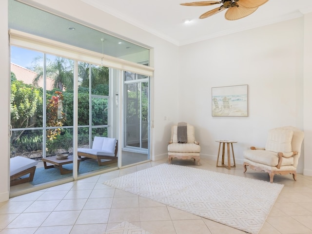 living area featuring light tile patterned floors, ceiling fan, and crown molding