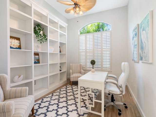 office area with wood-type flooring and ceiling fan