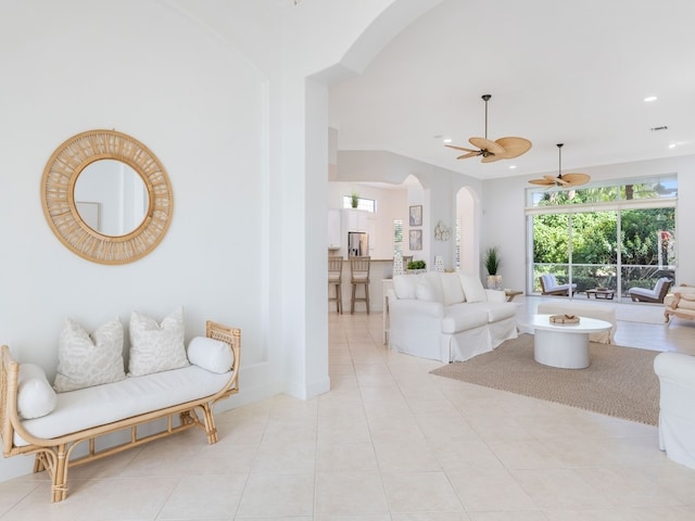 living room featuring light tile patterned flooring and ceiling fan