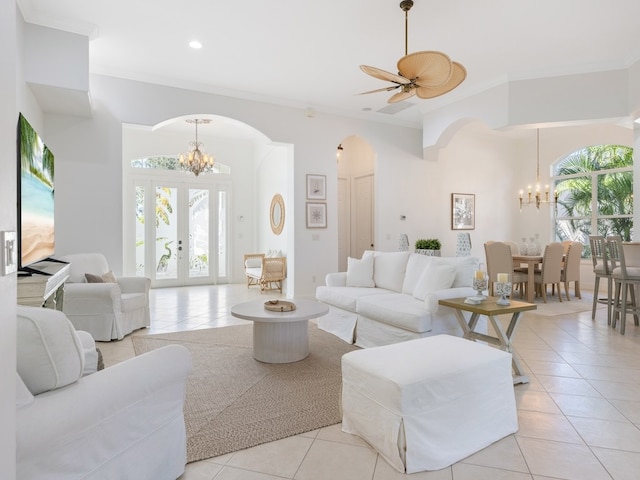 living room featuring a wealth of natural light, light tile patterned floors, and french doors