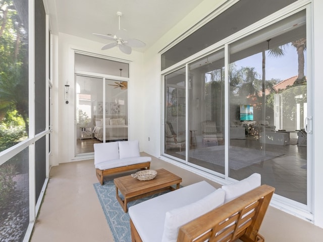 sunroom featuring ceiling fan