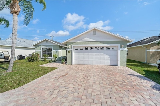 ranch-style house with a front yard, decorative driveway, and a garage