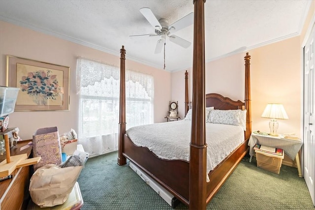 bedroom with ceiling fan, carpet floors, and ornamental molding