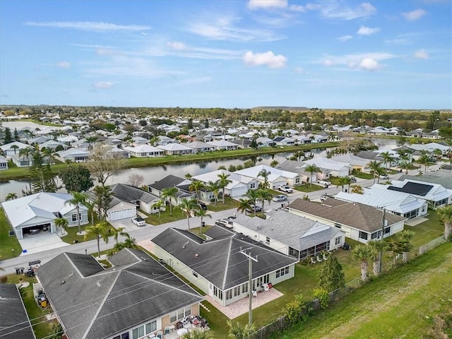 birds eye view of property featuring a residential view and a water view