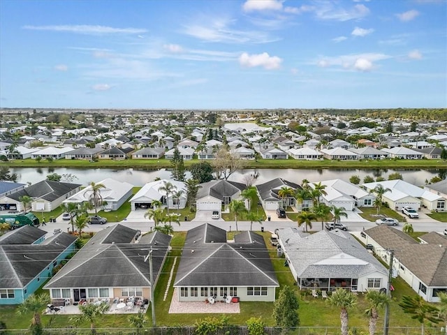 aerial view with a residential view and a water view