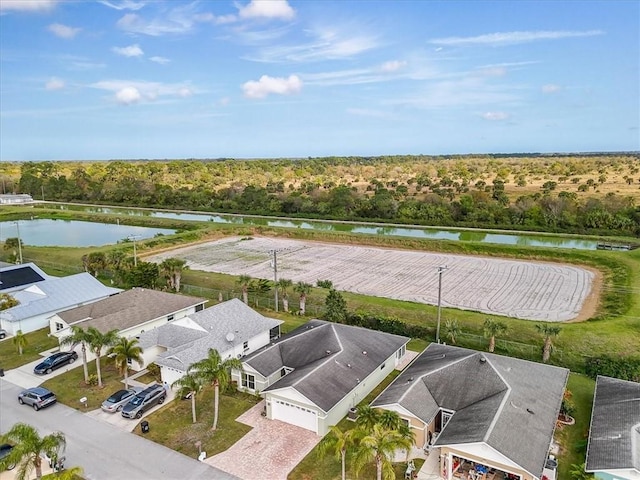 bird's eye view featuring a water view and a residential view