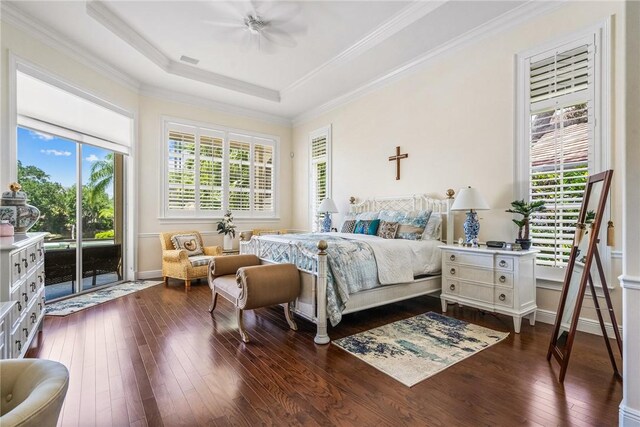 bedroom with access to outside, dark wood finished floors, crown molding, a tray ceiling, and ceiling fan