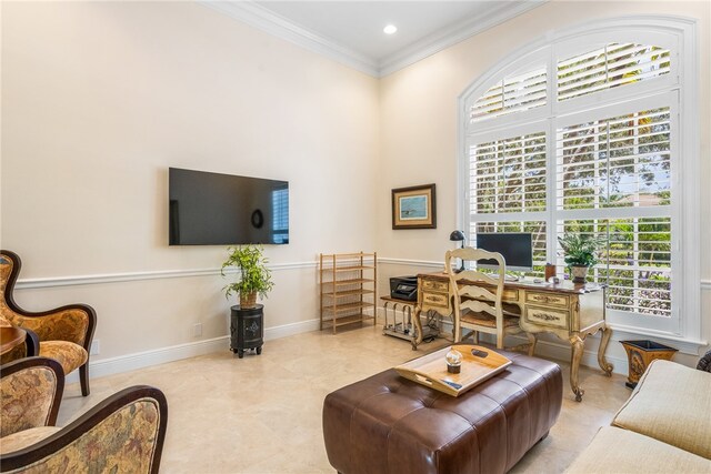 living room featuring a high ceiling and ornamental molding