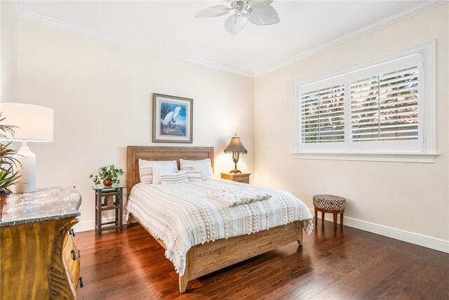 bedroom with ornamental molding, ceiling fan, and dark hardwood / wood-style floors