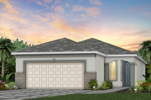 1359 Haven Cir, Vero Beach, FL 32960 - view of front of home with stucco siding, an attached garage, and concrete driveway