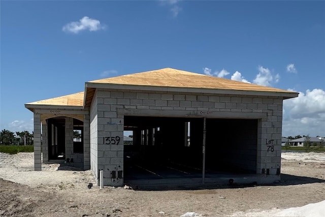 1359 Haven Cir, Vero Beach, FL 32960 - view of property exterior with concrete block siding and a garage