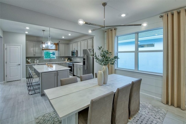1359 Haven Cir, Vero Beach, FL 32960 - dining area featuring a chandelier and recessed lighting