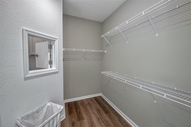 1359 Haven Cir, Vero Beach, FL 32960 - spacious closet with dark wood-style floors