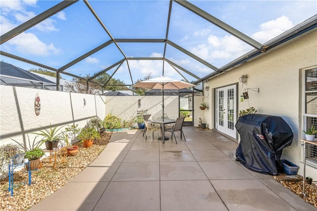 view of patio featuring a lanai, a grill, and french doors