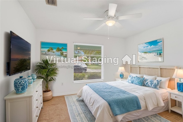 2500 89th Ave, Vero Beach, FL 32966 - bedroom featuring light carpet, baseboards, and ceiling fan