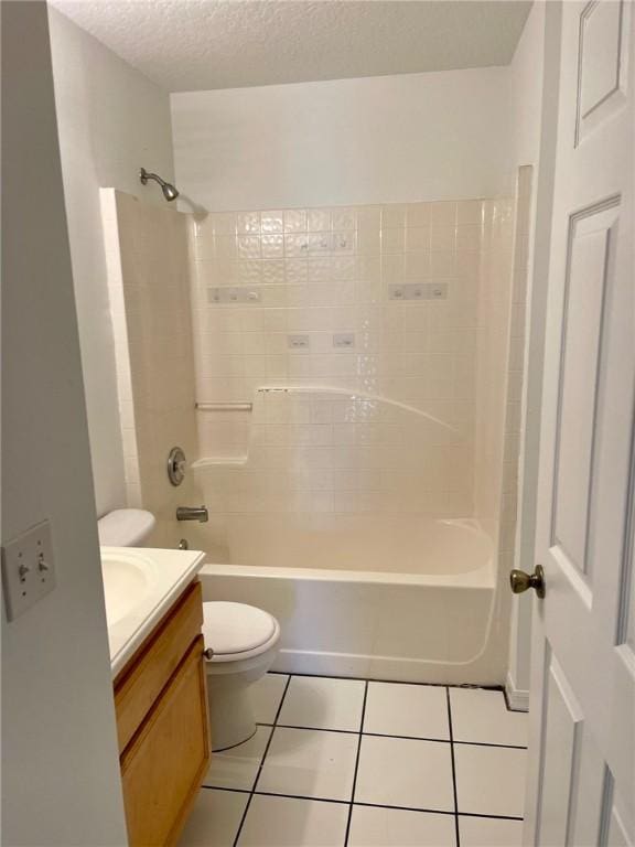 full bathroom featuring shower / bath combination, vanity, a textured ceiling, tile patterned floors, and toilet