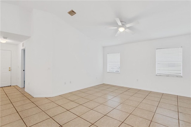 empty room featuring light tile patterned floors and ceiling fan