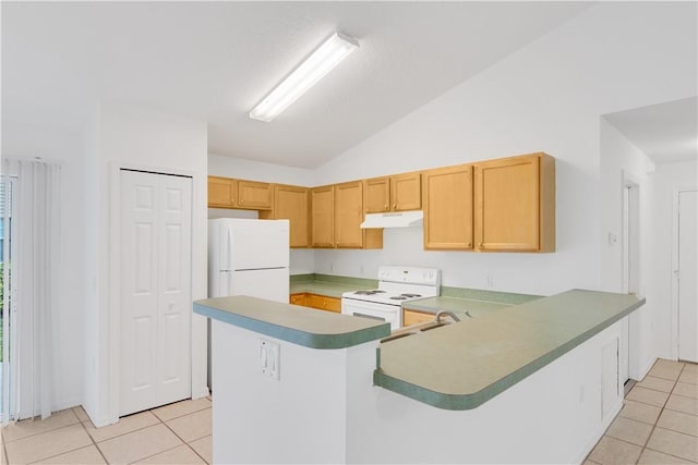 kitchen with light tile patterned flooring, lofted ceiling, white appliances, and kitchen peninsula