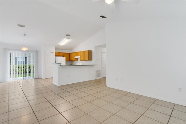 unfurnished living room with high vaulted ceiling, light tile patterned floors, and ceiling fan