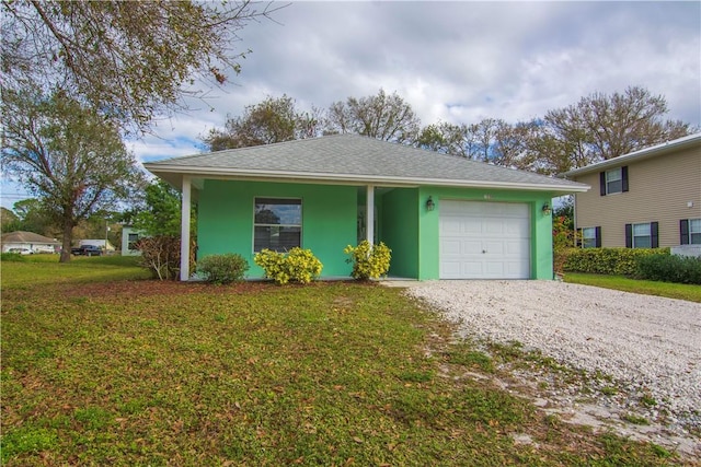 view of front facade featuring a garage and a front lawn