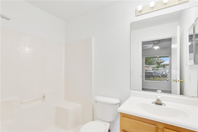 2500 89th Ave, Vero Beach, FL 32966 - bathroom with vanity, a shower, toilet, and ceiling fan