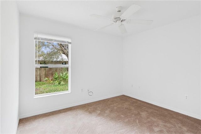 unfurnished room featuring carpet floors and ceiling fan