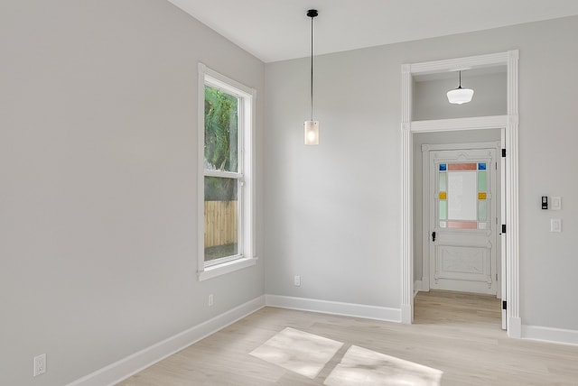 spare room featuring light hardwood / wood-style floors