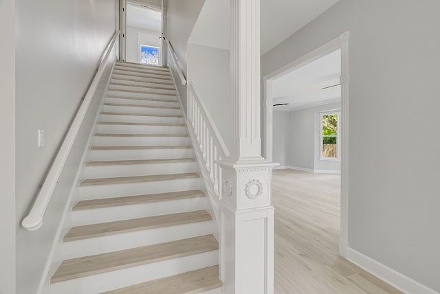 stairs featuring hardwood / wood-style floors