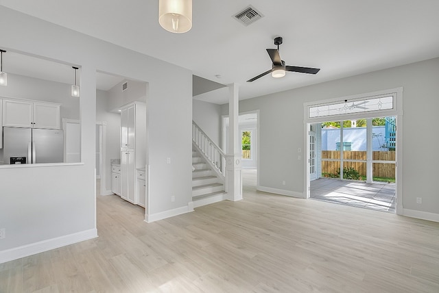 interior space featuring light wood-type flooring and ceiling fan