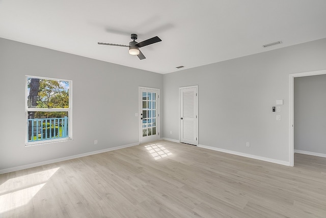 unfurnished room with light wood-type flooring and ceiling fan