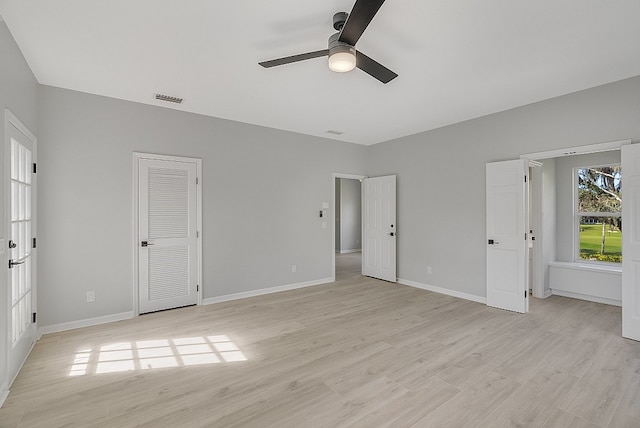 unfurnished bedroom with light hardwood / wood-style floors and ceiling fan