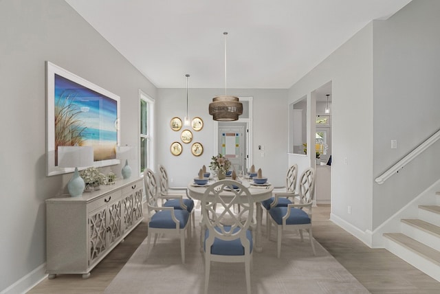 dining space featuring hardwood / wood-style floors