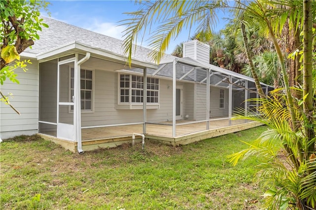 exterior space with a lanai and a yard