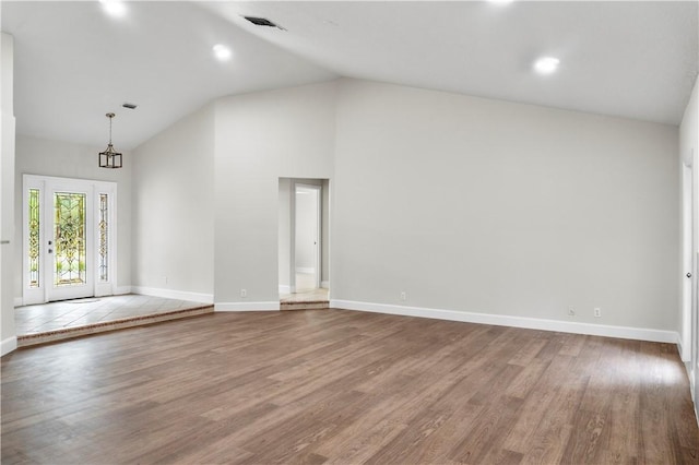 interior space featuring hardwood / wood-style floors and high vaulted ceiling