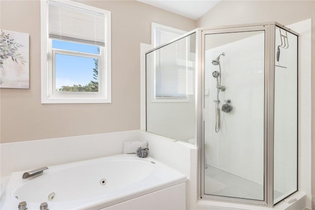 bathroom with separate shower and tub